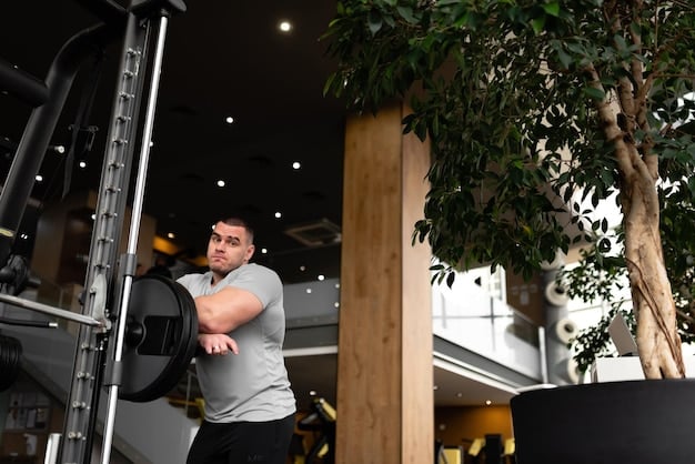 A man lifting weights in a gym, showcasing a healthy and active lifestyle. The focus is on his form and the effort he's putting into the exercise, emphasizing the importance of physical activity for testosterone production.