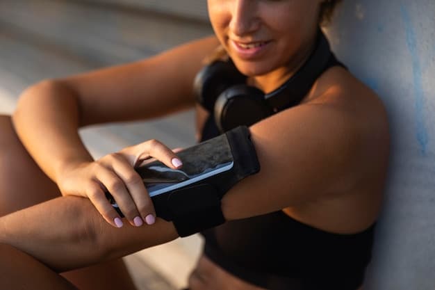 A person using a fitness tracker to monitor their range of motion during a stretching exercise. The tracker displays data related to flexibility and movement.