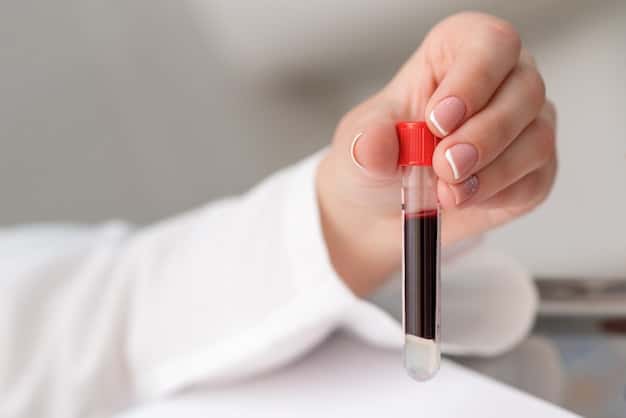 A close-up image of a blood test being drawn, with the focus on the vial filling with blood. The doctor is wearing gloves and the background is blurred to keep the focus on the medical procedure.