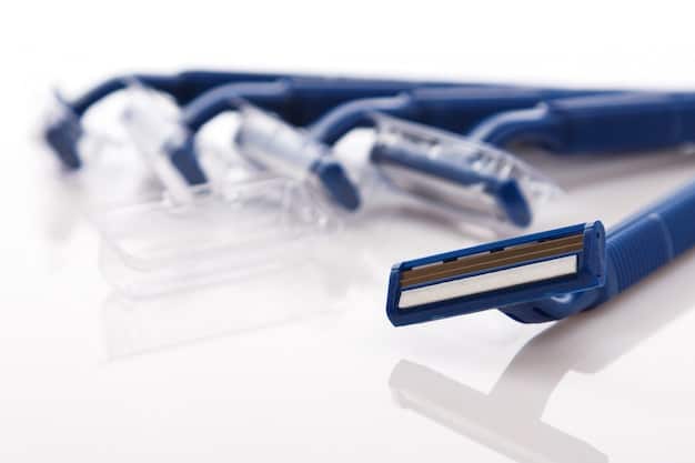 A variety of razors are laid out on a clean surface, including cartridge razors, safety razors, and straight razors. The focus is on the blades of each razor, showcasing their sharpness and design.