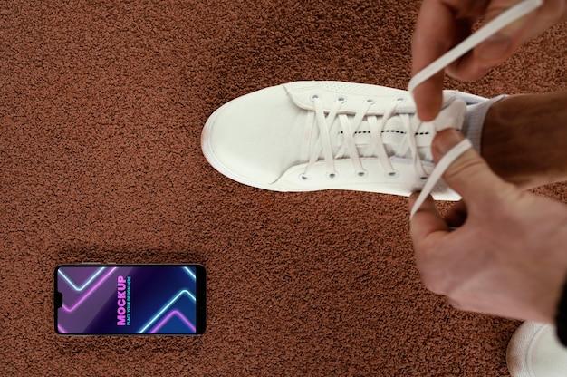 A close-up shot of a technologically advanced men's sneaker with visible cushioning, breathable fabric, and a digital display showing performance metrics.