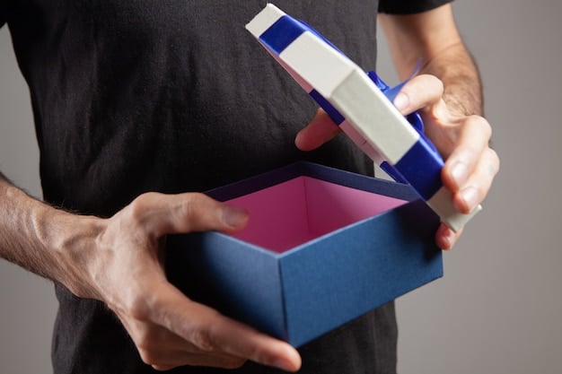 A close-up shot of a man's hands opening a grooming subscription box, revealing various grooming products like a razor, shave brush, and aftershave. The background is blurred, emphasizing the unboxing experience.