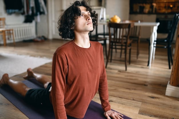 A man practicing deep breathing or meditation in a quiet, sunlit room, emphasizing stress reduction for heart health. His eyes are closed, arms resting.