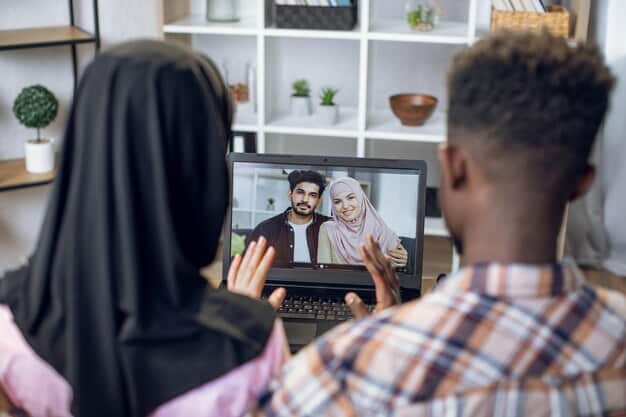A diverse group of professionals engaged in a virtual panel interview, with one person speaking and others listening attentively.