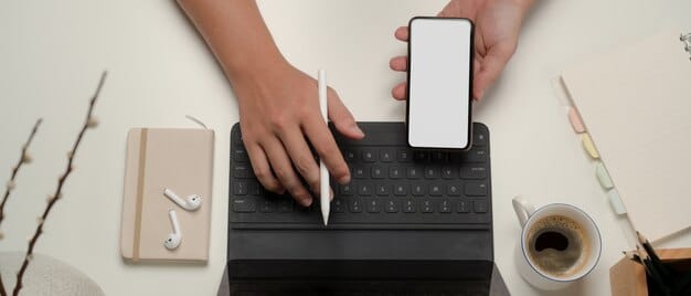 A close-up shot of a smartphone screen displaying a professional email draft, with fingers gently tapping on the keyboard, symbolizing the careful crafting of an outreach message.