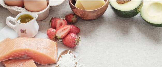 A variety of high-protein food sources displayed appetizingly on a kitchen counter, including chicken breast, eggs, Greek yogurt, lentils, and protein powder, symbolizing diverse options for increasing intake.