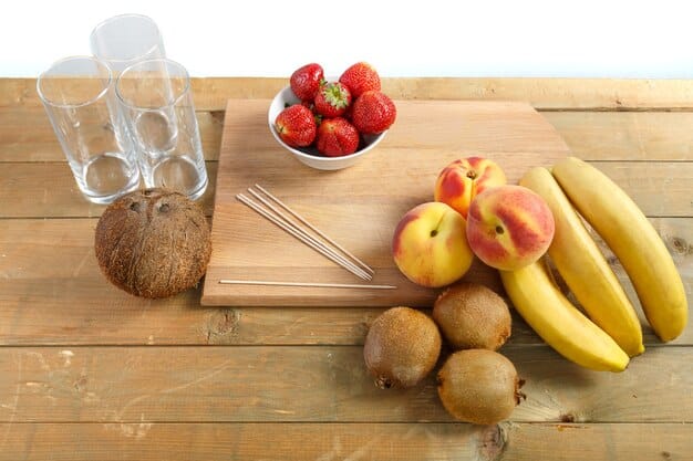A colorful array of fresh fruits and vegetables on a cutting board next to a glass of water and a protein shake, symbolizing healthy nutrition and hydration for fitness.