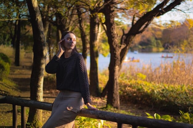 A person performing a brisk walk in a scenic park, wearing fitness trackers, with sunlight filtering through trees, conveying a sense of serenity and active lifestyle.