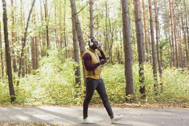 A person in athletic wear, dynamically performing a fitness activity (e.g., trail running, yoga, or weightlifting) in a vibrant, natural setting, symbolizing health, vitality, and performance.