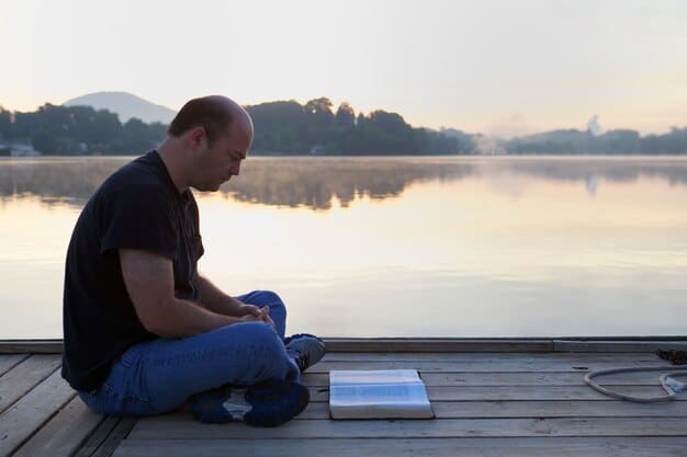 A man sitting alone, looking introspective, with a blurred background suggesting a moment of quiet contemplation or distress, emphasizing the internal struggle prior to seeking help.