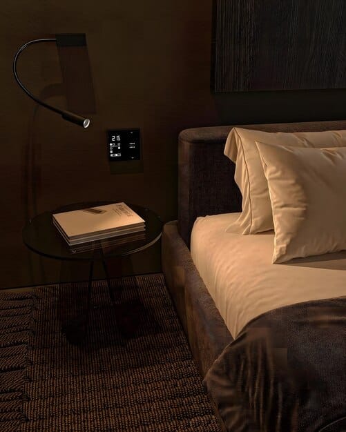 A minimalist, dark, and cool bedroom with dim lighting, perhaps a sleep mask on the nightstand, and no electronic devices visible, suggesting an optimal sleep environment.