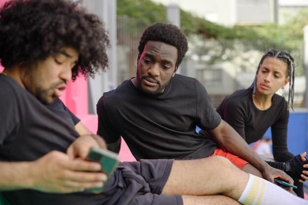 A man engaged in an intense but friendly conversation at a community sports club, demonstrating focused listening and active participation.