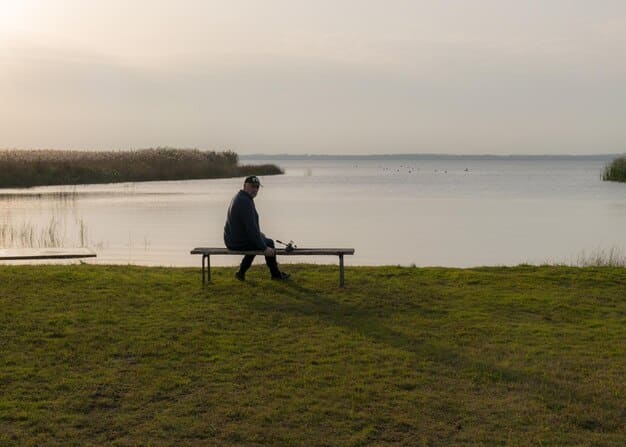 A man sits alone on a park bench, looking contemplative, symbolizing moments of isolation and reflection on personal challenges.