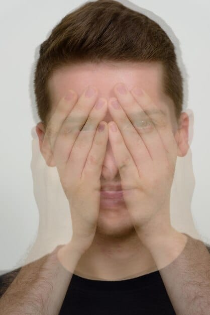 A detailed male face showing signs of stress and exhaustion, with subtle lines around the eyes, symbolizing the negative impact of neglecting self-care.