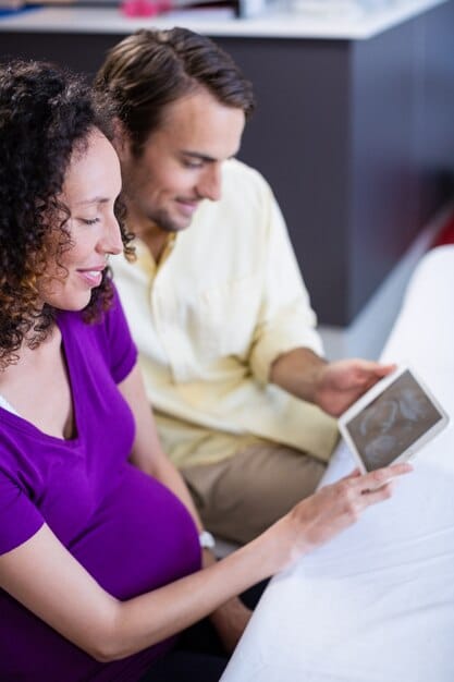 A couple consulting a fertility specialist, discussing options for assisted reproductive technologies.