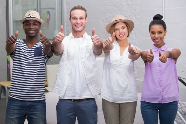 A friendly, diverse group of people (male and female, various ethnicities) engaged in an open, respectful conversation about sexual health, sharing brochures or information, with condoms subtly in the background on a table.
