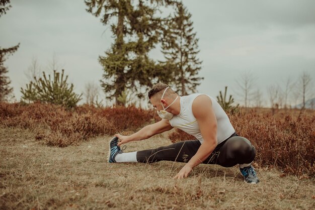 A man in athletic wear performing a gentle stretching exercise outdoors, with a serene expression, indicating well-being and active lifestyle choices that support male fertility.