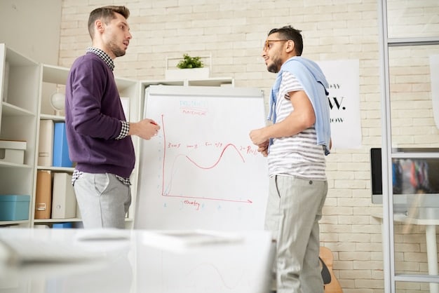 Two male professionals in a modern office, collaborating at a whiteboard with charts and graphs. They are discussing strategy and appear engaged and productive, illustrating teamwork and problem-solving skills relevant to 'Ace Your Next Job Interview: Insider Tips and Strategies for Male Professionals in 2025'.