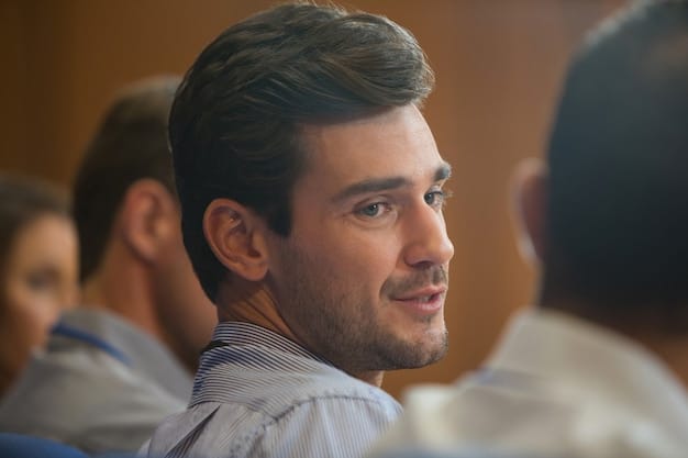 A close-up shot of a male professional's face during an interview, showing direct eye contact and an attentive, engaged expression. The focus is on conveying trustworthiness and confidence, key aspects of 'Ace Your Next Job Interview: Insider Tips and Strategies for Male Professionals in 2025'.