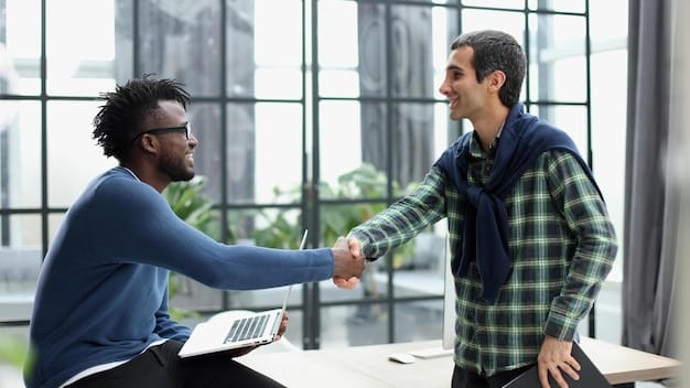 A male immigrant confidently shaking hands with a US-born colleague in a modern office, symbolizing successful cultural adaptation and integration in the workplace environment, which is essential when Building a Successful Career in the US: Essential Tips for Male Immigrants in 2025.