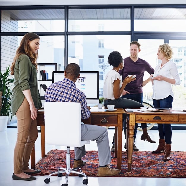 A diverse team of professionals collaborating on a project in a modern office setting, showcasing the collaborative and innovative nature of the technology industry and its potential for 