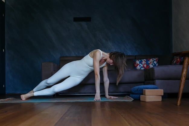 A person holding plank position in a living room. The posture is straight, the body is aligned between the head and the heels. The room is well illuminated.