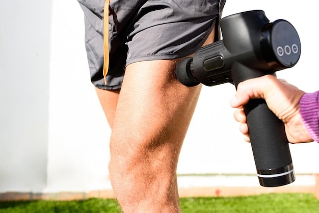 A close-up of a male athlete's legs being massaged with a massage gun. The focus is on the device and the athlete's toned calf muscles. The setting is a modern training room with fitness equipment in the background. This visual emphasizes massage tools as an important aspect of The Best Post-Workout Recovery Strategies for Men in 2025.