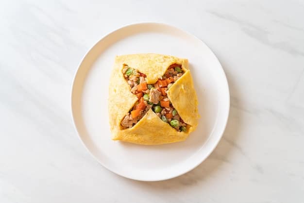 A top-down view of a colorful breakfast burrito cut in half, revealing a filling of scrambled eggs, black beans, shredded cheese, and diced tomatoes. Next to the burrito is a small bowl of salsa and a sliced avocado, showcasing the ingredients as part of a balanced and protein-rich breakfast from the selection of 7 High-Protein Breakfast Ideas to Fuel Your Day.