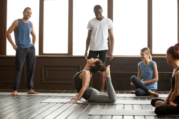 A diverse group of men in a yoga class, performing a standing forward bend. They are focused and stretching their hamstrings. The setting is a bright, modern studio, emphasizing inclusivity and the practical application of the benefits of yoga for men in a community setting.