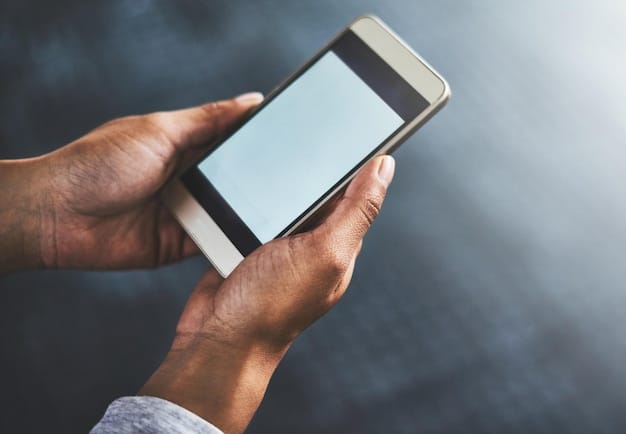 A close-up image of a diverse man's hand reaching for a phone, with the 988 logo subtly displayed on the screen. The background is blurred, emphasizing the focus on immediate help and accessibility to highlight How the New 988 Mental Health Hotline is Saving Men's Lives in 2025.