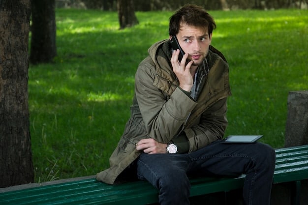 A close-up, slightly blurred image of a man looking thoughtful while sitting on a park bench, head in his hands. The background is soft, with blurred trees and sunlight. This represents the internal struggle many men face with their mental health. The image reflects Overcoming the Stigma: How Men Can Talk Openly About Mental Health.