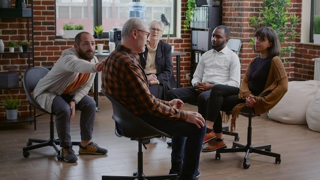 A diverse group of men sitting in a circle, engaged in a support group discussion. They are looking at each other with empathy and understanding, creating a sense of camaraderie and support. The setting is comfortable and inviting, encouraging open communication. Reflects themes in 'Recognizing Burnout: A Guide for Men to Identify and Address Workplace Stress'.