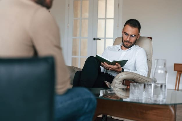 A man talking to a therapist in a comfortable office setting. The therapist is listening attentively and taking notes. The atmosphere is calm and supportive, highlighting the process of seeking help related to 'How to Identify the 5 Early Warning Signs of Burnout in Male Professionals (and What to Do in 2025)'.