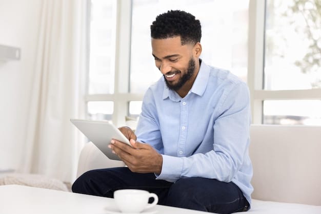 A man smiling confidently while using a budgeting app on his tablet, sitting at a desk with organized papers and a cup of coffee. The scene represents taking control of finances and reducing stress, reflecting The Impact of Financial Stress on Men's Mental Health: How to Build Resilience and Seek Support.