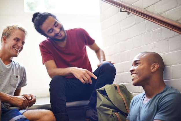 A group of diverse men participating in a support group. Some are sharing their experiences while others are listening attentively. The atmosphere is warm and supportive. The image demonstrates the power of community and shared experience in addressing mental health challenges, reinforcing the importance of support systems in 'Recognizing and Addressing the Signs of Depression in Men: A Comprehensive Guide'.