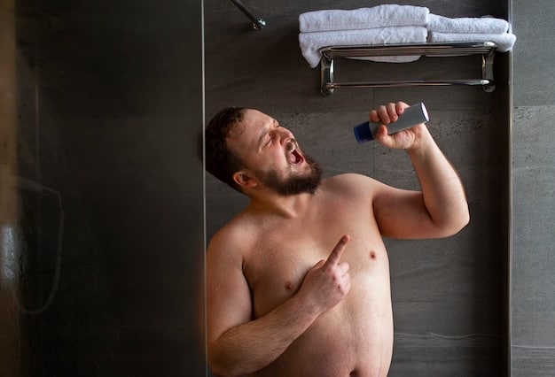 A man gently washing his penis in the shower with mild soap and water. The image should be focused on the action of cleaning and the cleanliness of the shower environment. This image illustrates the importance of what every man should know about penile health and hygiene.