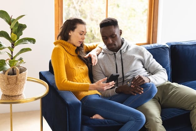 A diverse couple sitting on a couch and having an open and honest conversation about sexual health. They are looking at each other with smiles, and informational brochures about STI prevention are visible on the coffee table.