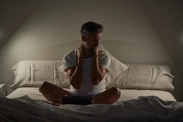 An individual sitting on the edge of a bed, looking stressed and overwhelmed, with hands on their head, illustrating the impact of anxiety on sexual wellbeing regarding Understanding the Psychological Factors Affecting Sexual Performance.