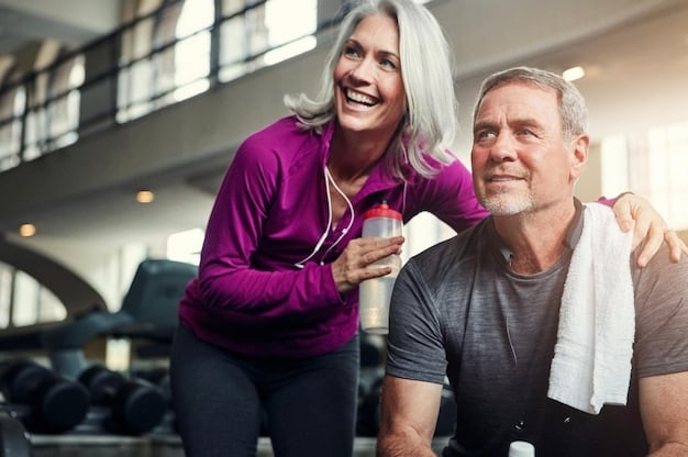 A couple in their early 30s are laughing together while stretching after a workout. They are in athletic clothing, in a bright and modern gym setting. This image shows the benefits of exercise, enhancing the theme: The Role of Exercise in Boosting Your Sex Drive: A Workout Plan for Enhanced Performance by showing couple's fitness and happiness.